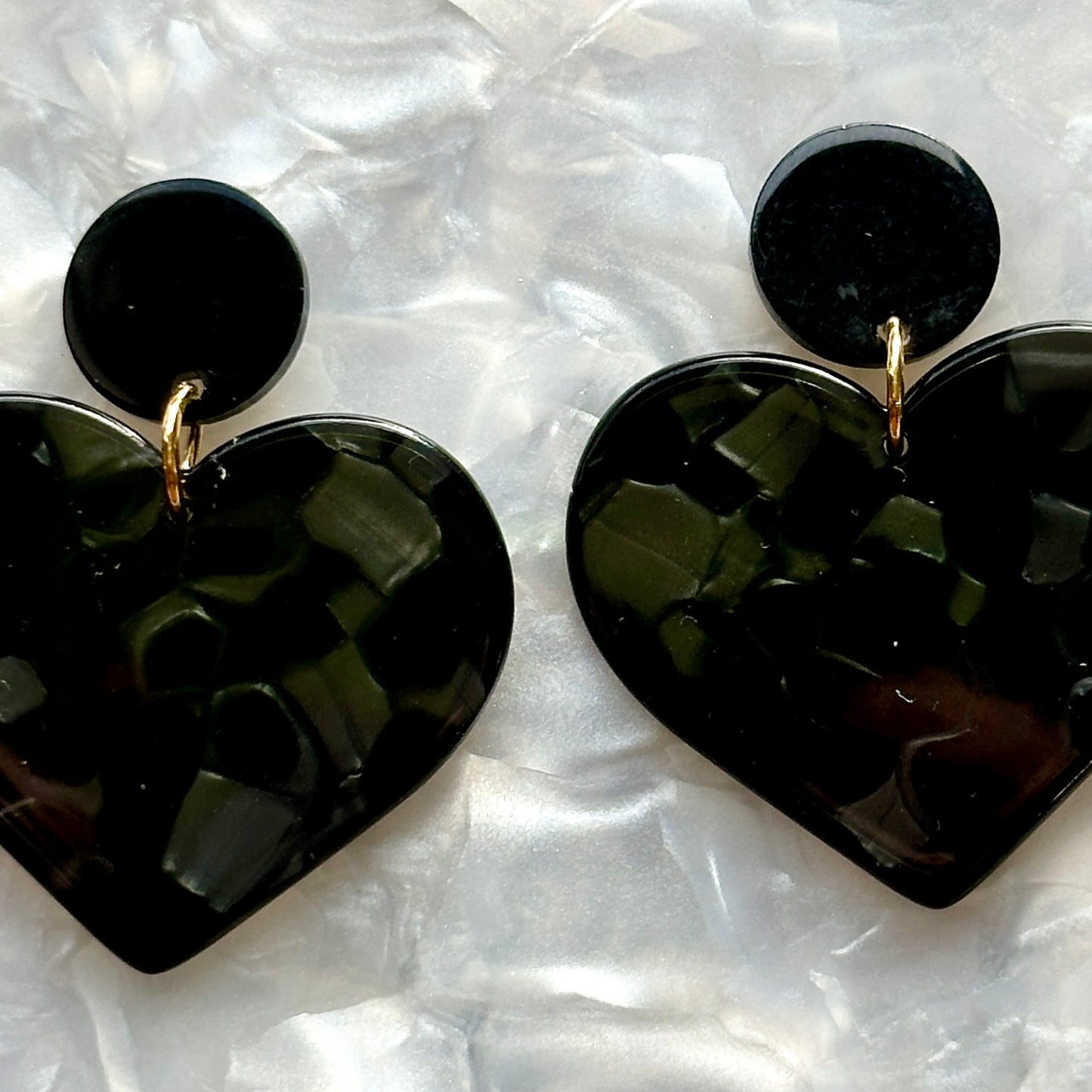 close up of acrylic Heart Earrings in Black