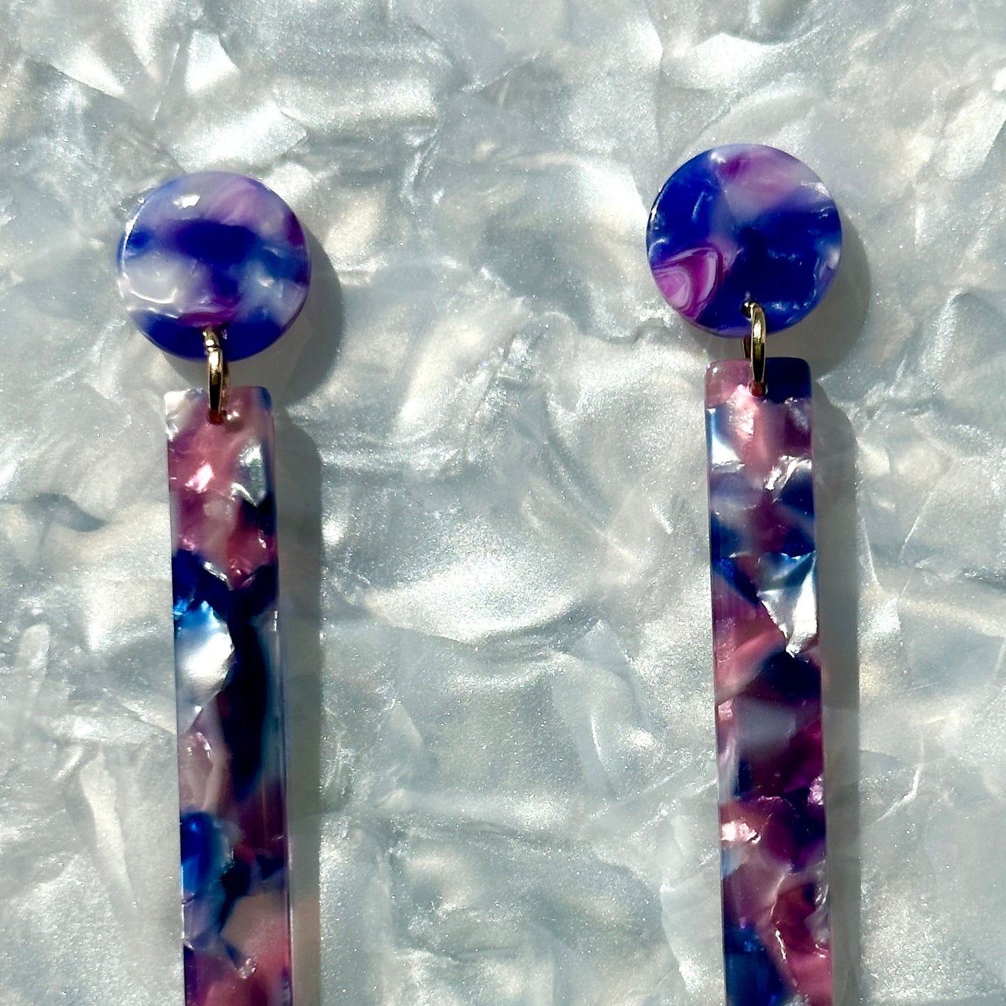 close up of acrylic Matchstick Drop Earrings in Purple
