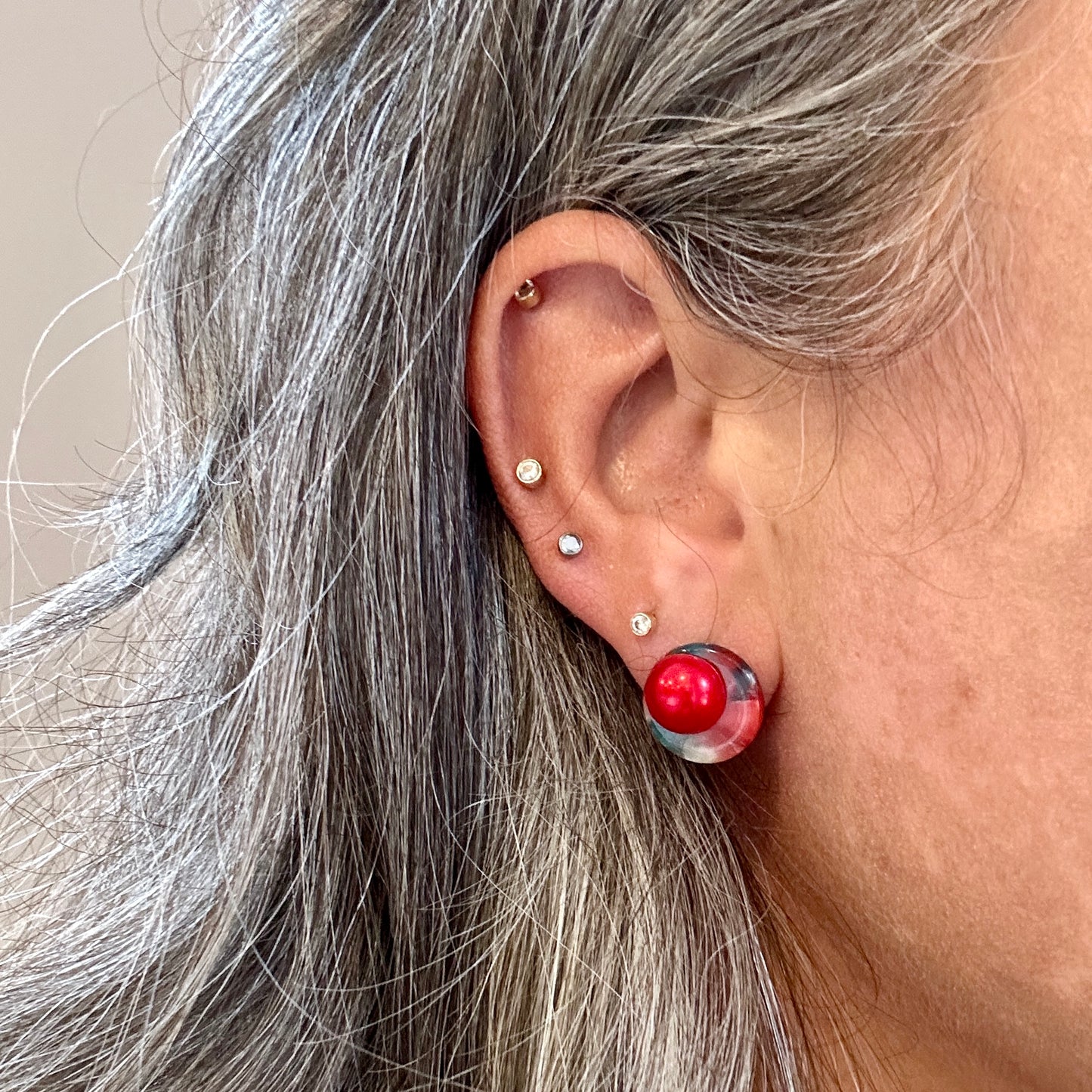 woman wearing acrylic Stud Earrings in Red and green