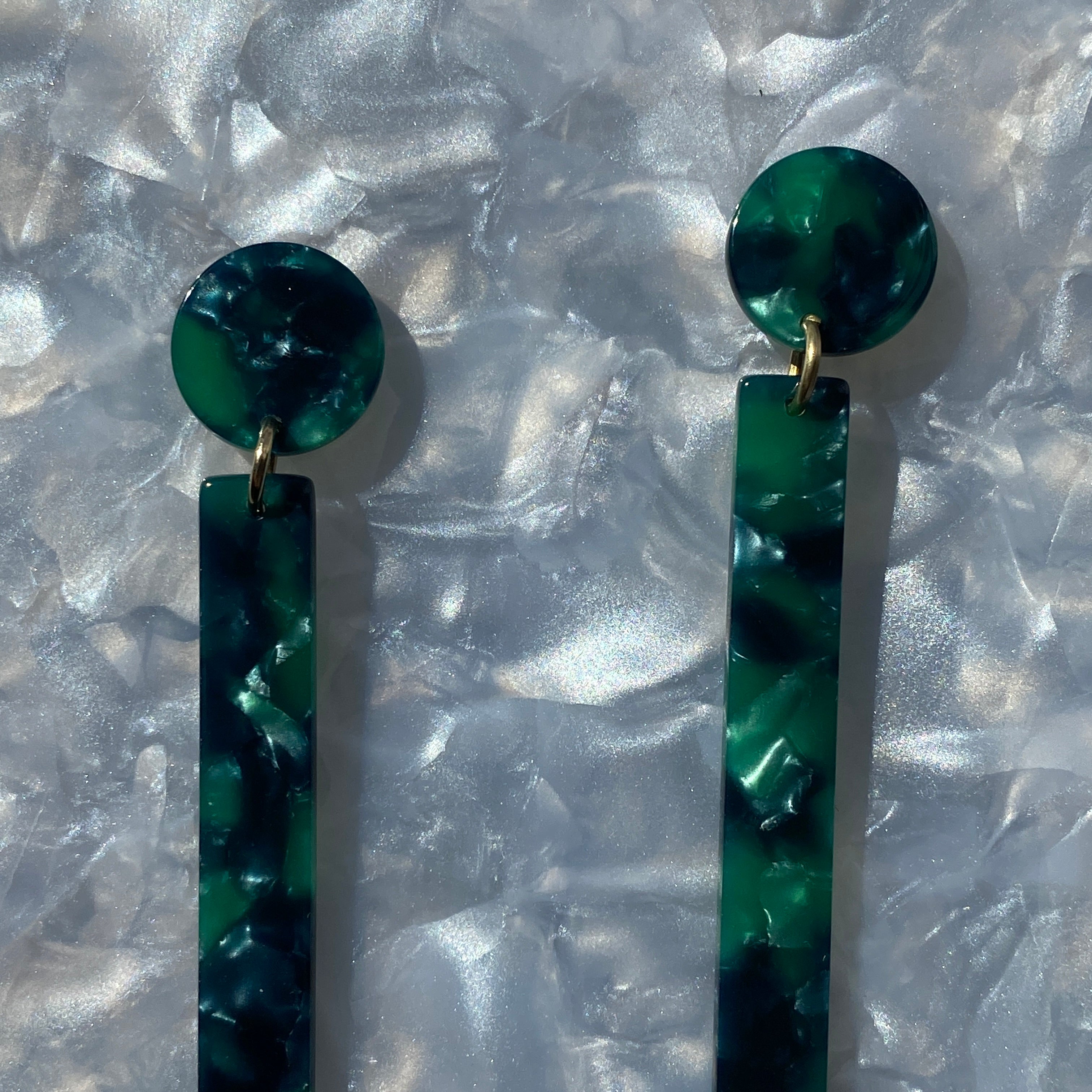close up of acrylic Matchstick Drop Earrings in Emerald Green